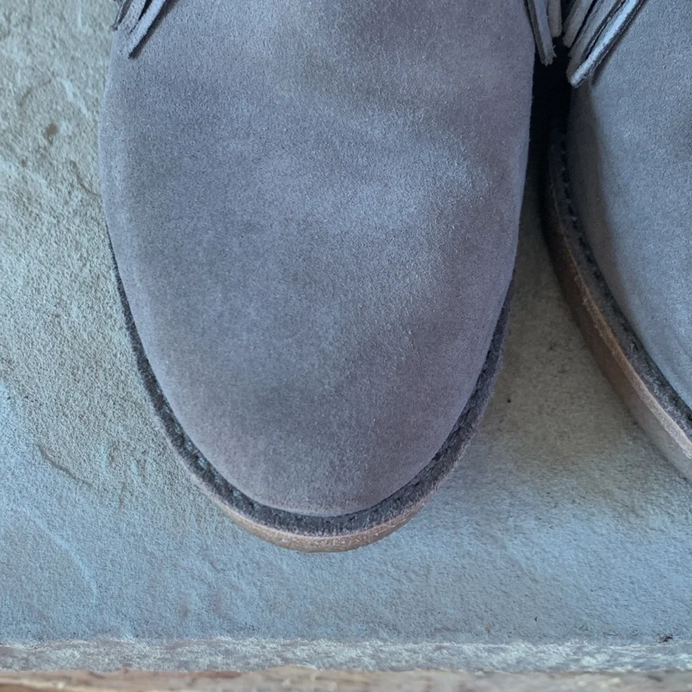 UGG sz 9 taupe heeled booties with front fringe and rubber heel